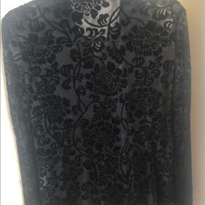 Women’s medium black shear blouse. Hip length.